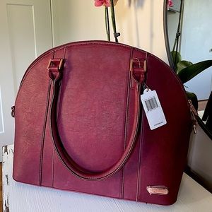 Beautiful, burgundy Little Unicorn baby bag.